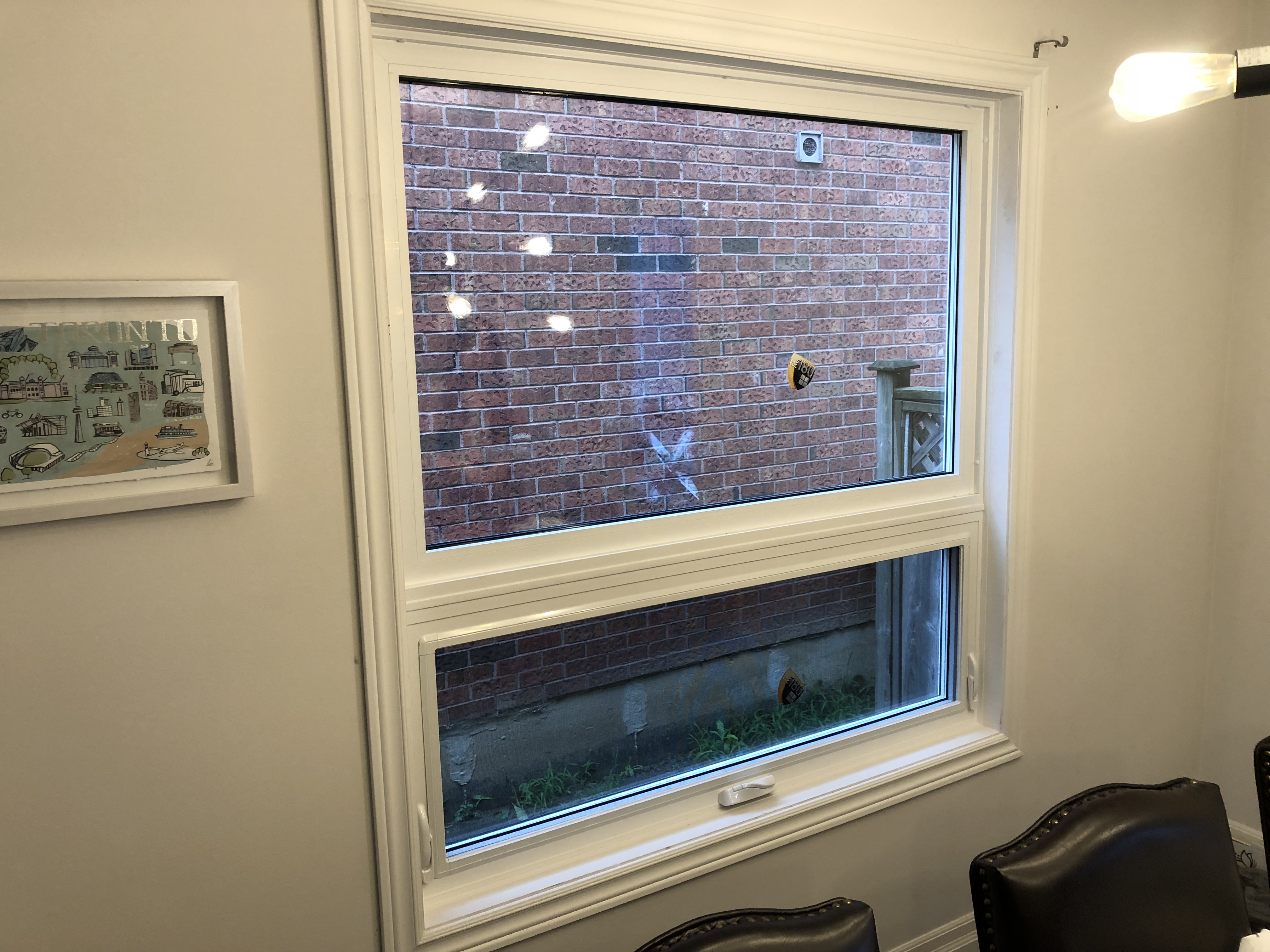 Newly installed energy‑efficient windows on a Queensville home, showing a modern interior view with a white window frame.