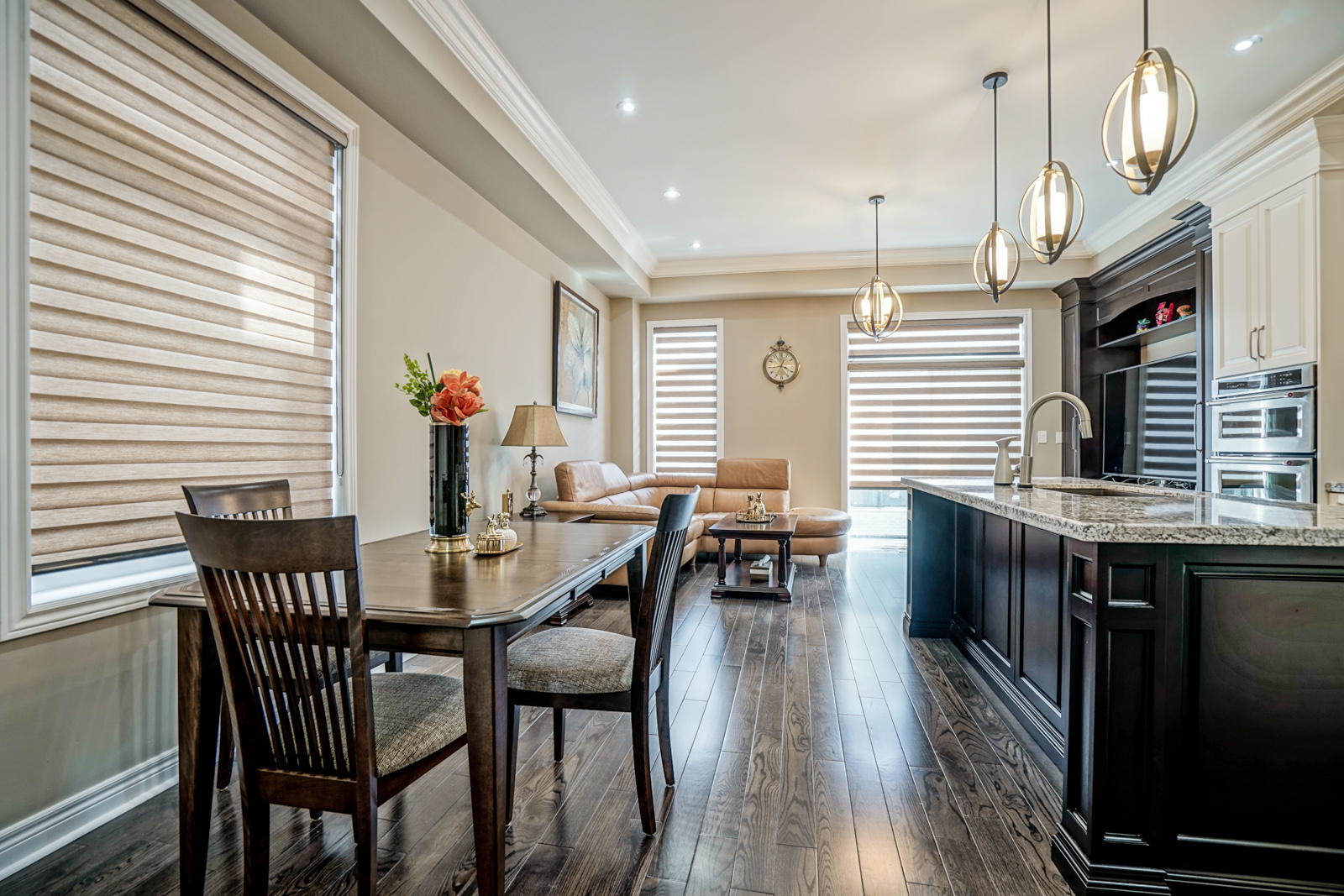 Modern kitchen with white cabinetry, marble backsplash 